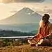 A serene and contemplative scene of Advaita Vedanta, the spiritual philosophy of non-duality. In the foreground, a sage sits cross-legged, eyes closed in deep meditation, radiating an aura of tranquility. The middle ground features a picturesque landscape of rolling hills, lush vegetation, and a tranquil lake reflecting the sky above. In the background, a majestic mountain range stands tall, its peaks illuminated by a warm, golden light, symbolizing the transcendent nature of the Absolute. The overall atmosphere is one of introspection, unity, and the dissolution of the individual self into the universal consciousness. Soft, diffused lighting creates a dreamlike, ethereal quality, inviting the viewer to contemplate the essence of Advaita Vedanta.