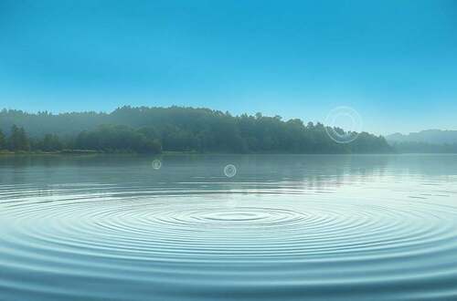 A serene, ethereal landscape depicting the intricate connection between water and consciousness. In the foreground, a tranquil pond reflects the sky above, its surface rippling with a subtle, hypnotic pattern. Floating amidst the water, glowing orbs of energy represent the conscious awareness that permeates the element. In the middle ground, a lush, verdant forest frames the scene, suggesting the natural harmony between water, life, and the unseen forces of the mind. The background is a soft, dreamlike gradient of blues and greens, evoking a sense of transcendent, holistic understanding. The lighting is soft and diffused, creating a sense of warmth and mysticism. The overall composition and atmosphere invite the viewer to contemplate the profound interconnectedness of water, health, and the depths of human consciousness.